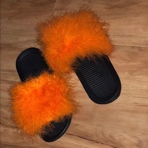 Orange fuzzy slides .